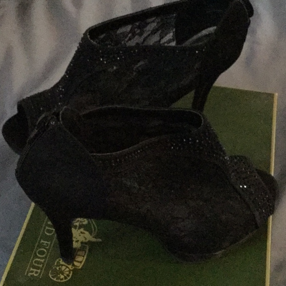 Zip up, heeled, peep toe black booties. HOT!